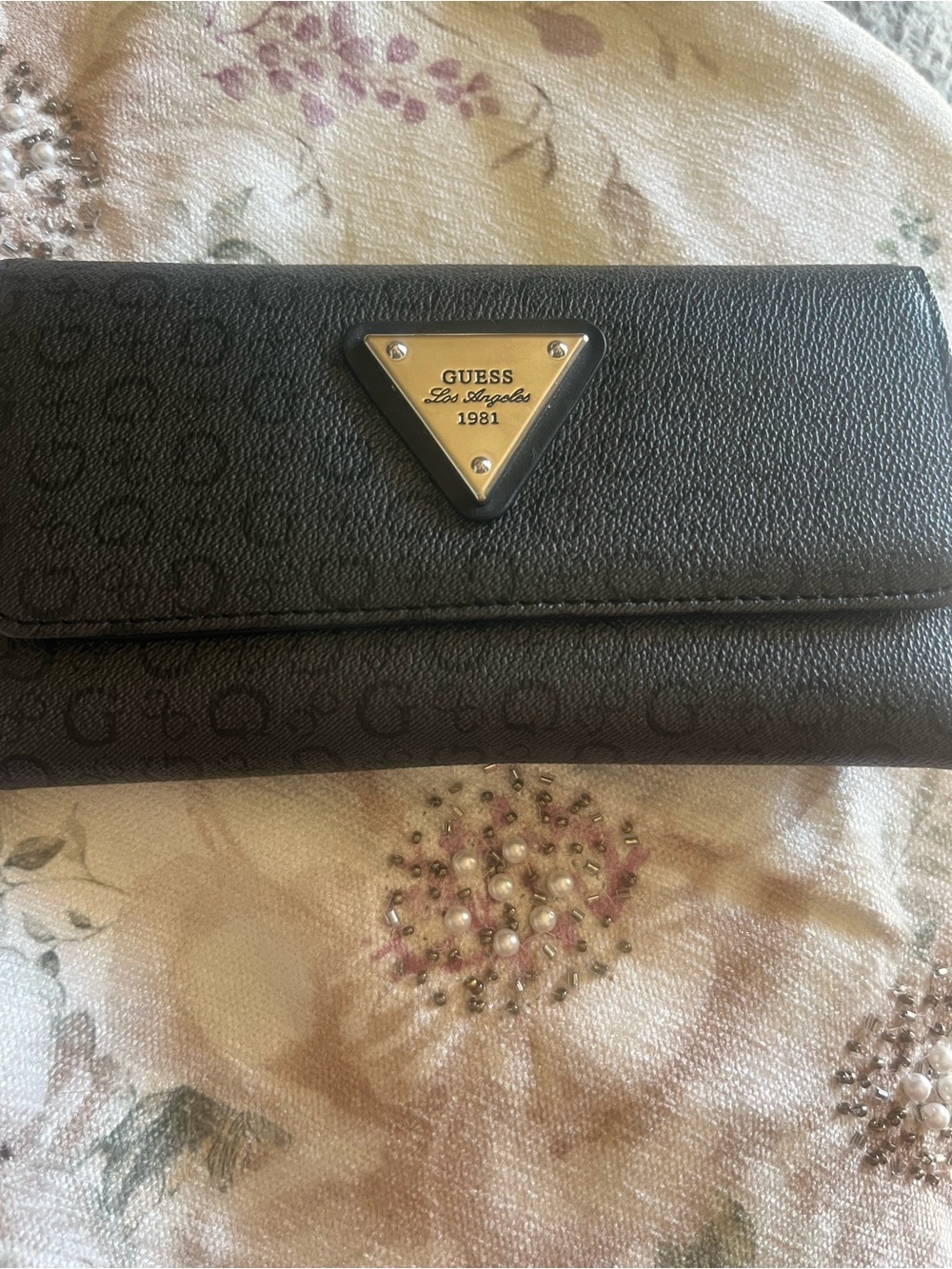 GUESS Black Continental Wallet with Silver Triangle Logo